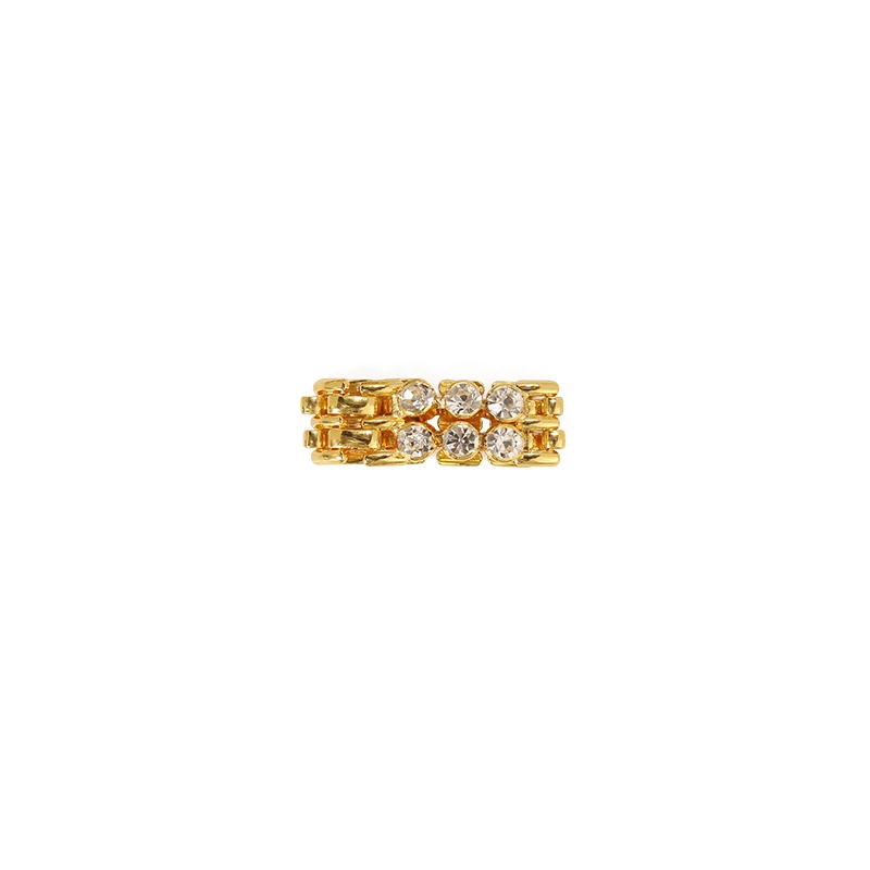 Hand wearing LIVKE gold zircon rings with geometric layout, paired with minimalist bands for urban chic style
