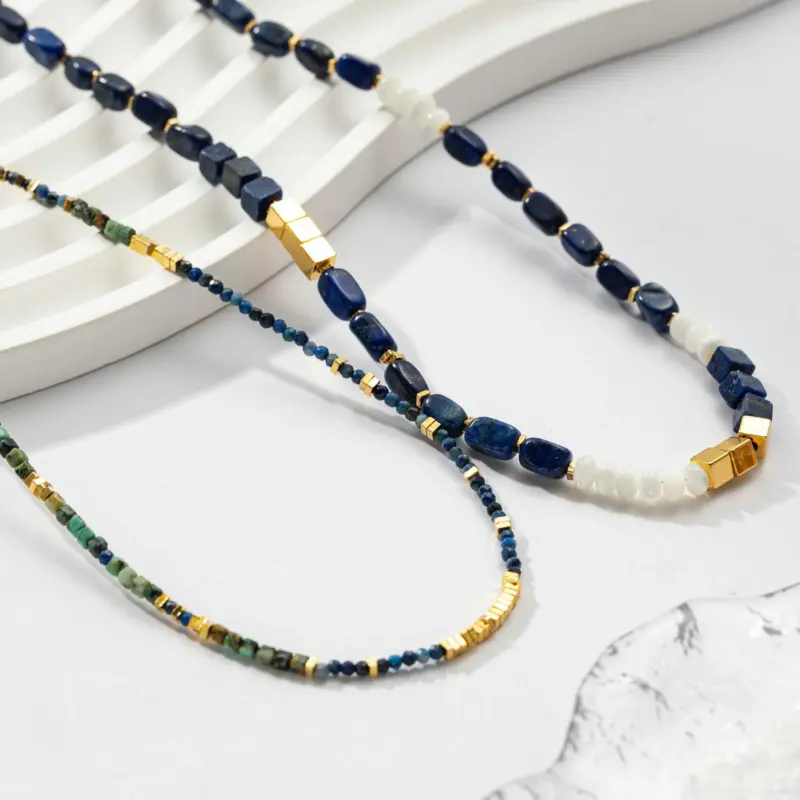 Woman wearing LIVKE lapis lazuli and gold beaded necklace with tailored black dress, showcasing mysterious yet elegant office-to-event jewelry
