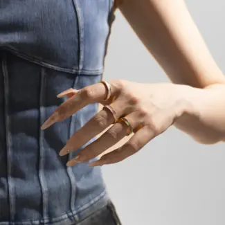 LIVKE 18K gold-plated mother-of-pearl rings in three colors (white/pink/grey) stacked on finger with minimalist outfits