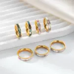 LIVKE 18K gold-plated mother-of-pearl rings in three colors (white/pink/grey) stacked on finger with minimalist outfits