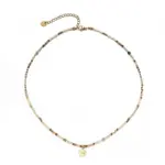 Woman wearing LIVKE multi-color stone necklace at desert festival, showcasing boho jewelry with adjustable gold pendant