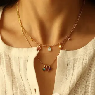 Woman wearing LIVKE multicolor zirconia necklace transitioning from office blazer to cocktail dress, showcasing prismatic jewelry for versatile styling