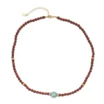 LIVKE’s 18K gold-plated red agate necklace layered with delicate chains on a linen backdrop, styled for boho-chic elegance