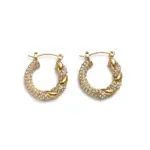 Gold twisted hoop earrings catching sunlight with layered necklaces on tanned skin