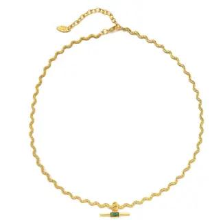 LIVKE chunky brass chain necklace with emerald-cut green zirconia pendant styled with black turtleneck for retro-modern elegance.