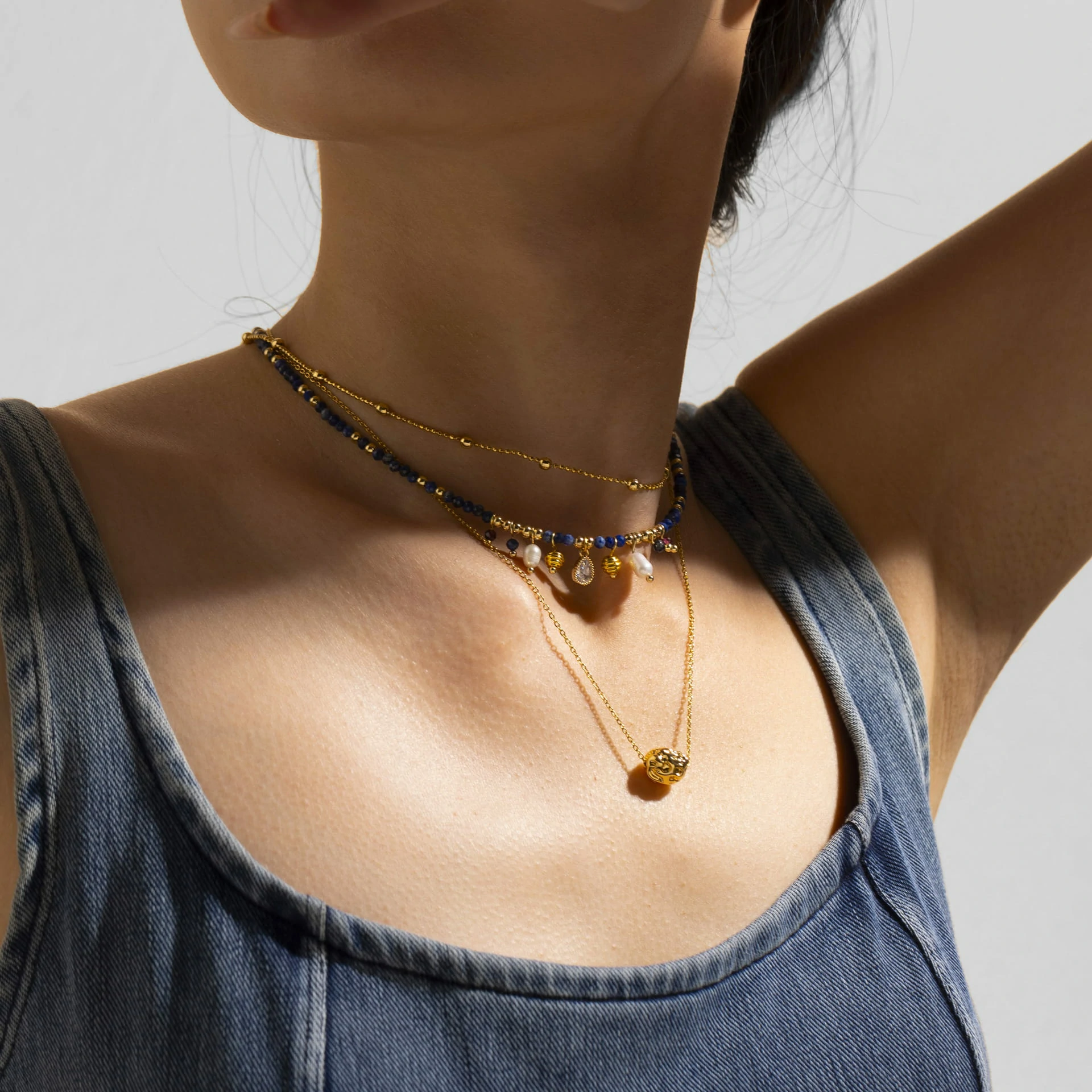 livke-vintage-pearl-layered-necklace-coastal-style (3) LIVKE 18K gold-plated layered necklace with colored pearls and zirconia, styled with linen and seashells for coastal minimalist aesthetic