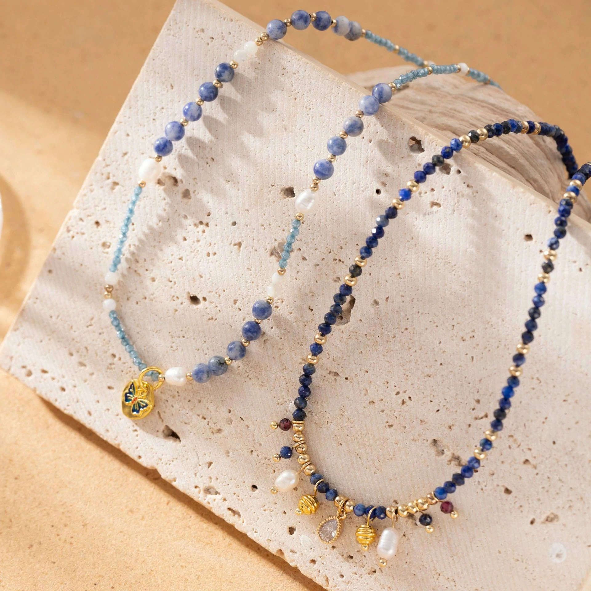 livke-vintage-pearl-layered-necklace-coastal-style (4) LIVKE 18K gold-plated layered necklace with colored pearls and zirconia, styled with linen and seashells for coastal minimalist aesthetic