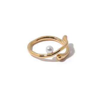 Hand model adjusting open wave ring with pearl under golden hour sunlight