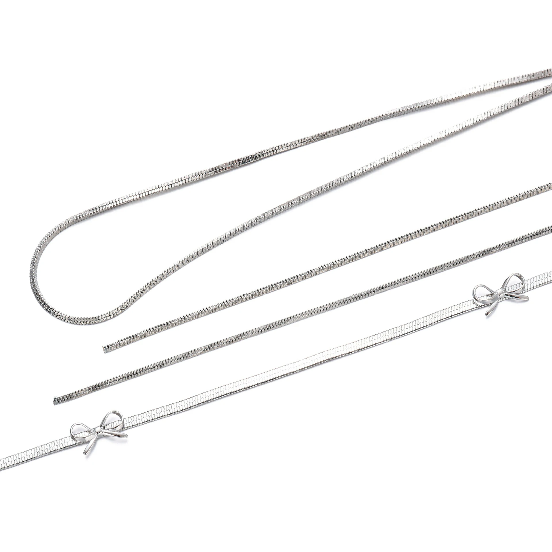 livke-white-gold-bow-necklace-bridal-luxury-layering (3) Bride wearing LIVKE white gold bow necklace with off-shoulder wedding dress, showcasing elegant bridal jewelry under sunset light