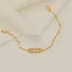 Gold chunky chain bracelet with crystal-encrusted floral pendant, perfect for statement jewelry lovers and art deco inspired accessories
