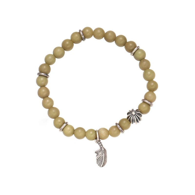 livke-sacred-forest-bracelet-energy-healing (4) Olive green aventurine bead bracelet with silver feather charm and floral spacer beads, designed for spiritual healing and crystal energy jewelry lovers