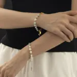 Gray Pearl Bracelet 3 Gray Akoya pearls alternating with rhodium-plated chain links, embodying modern Japandi style for mindfulness jewelry enthusiasts